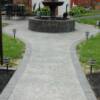 Stamped fountain Roman slate cobble border